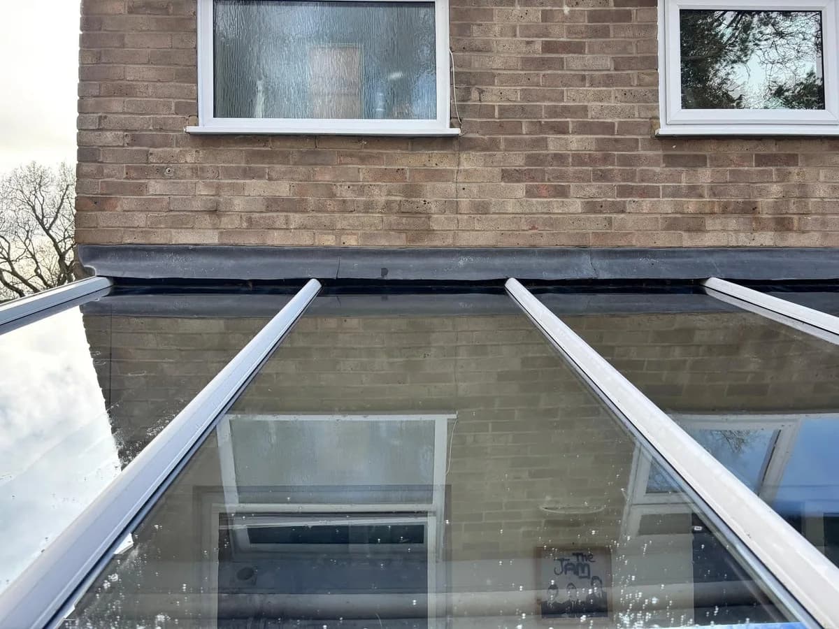 The same conservatory glass roof after moss removal and cleaning